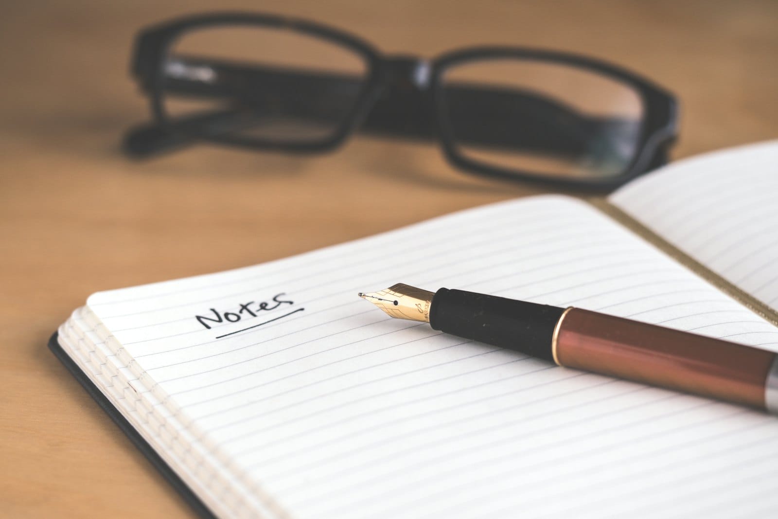 A notebook and pen on a desk for planning